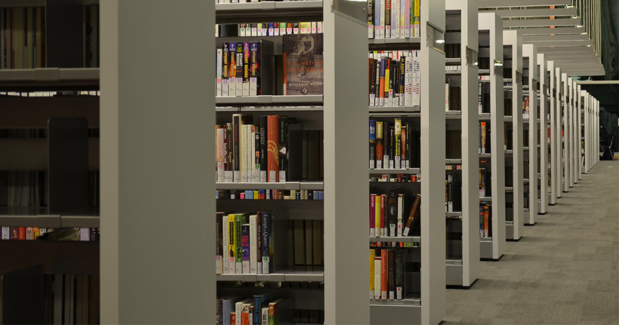 Shelves with books on them in a library
