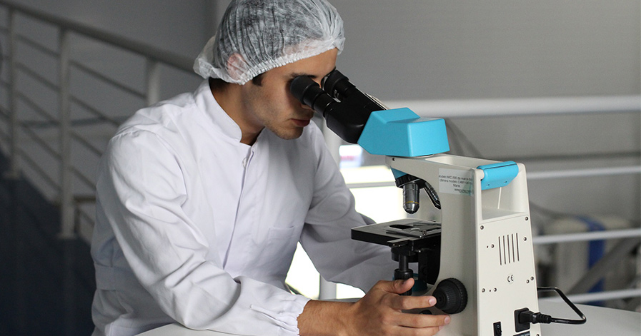Man looking in a microscope