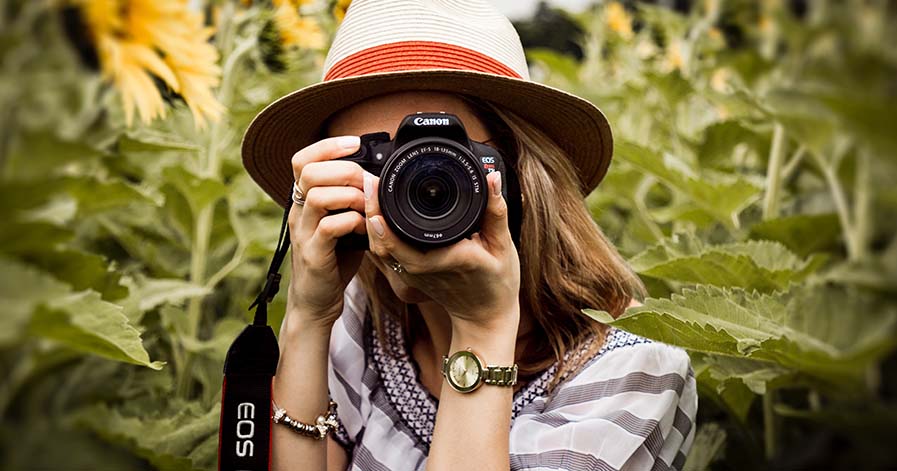 A woman is holding a camera